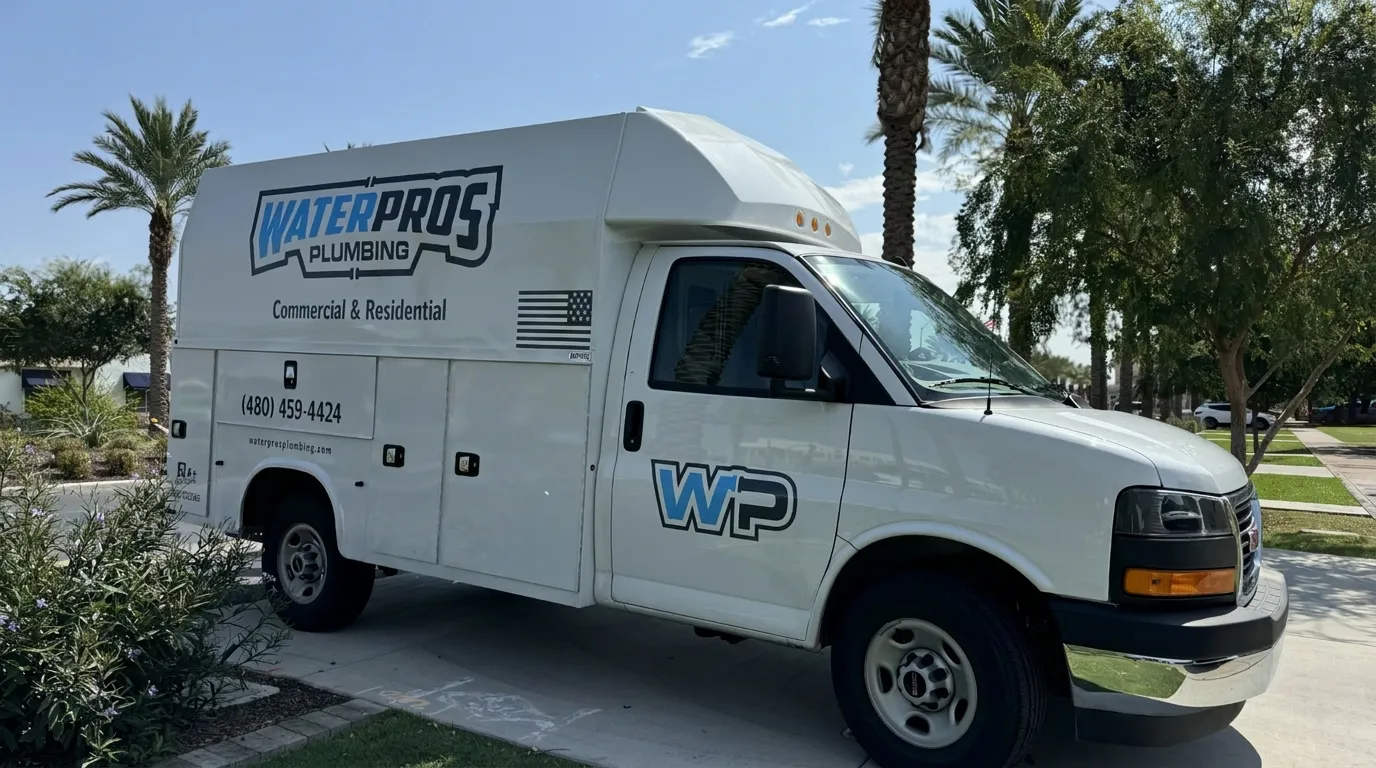 Water Pros Plumbing technician installing an under-sink RO system