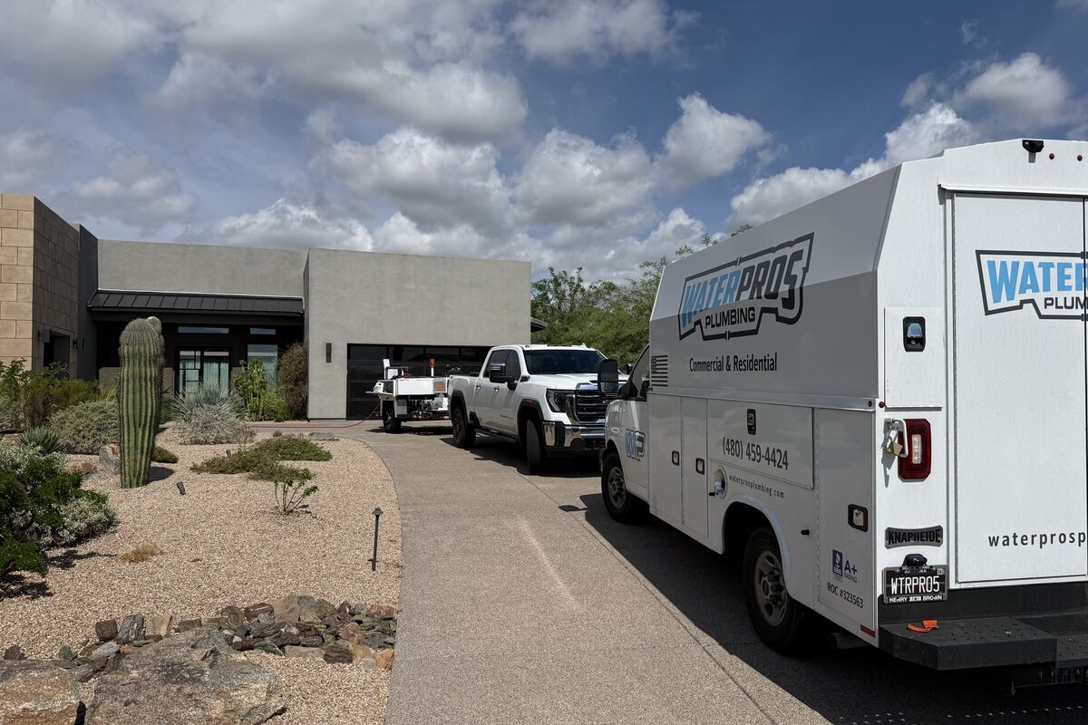 Water Pros Plumbing & Drain service truck parked in an Arizona neighborhood