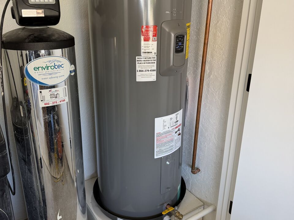 Water heater and water softener installed side by side in a Gilbert garage