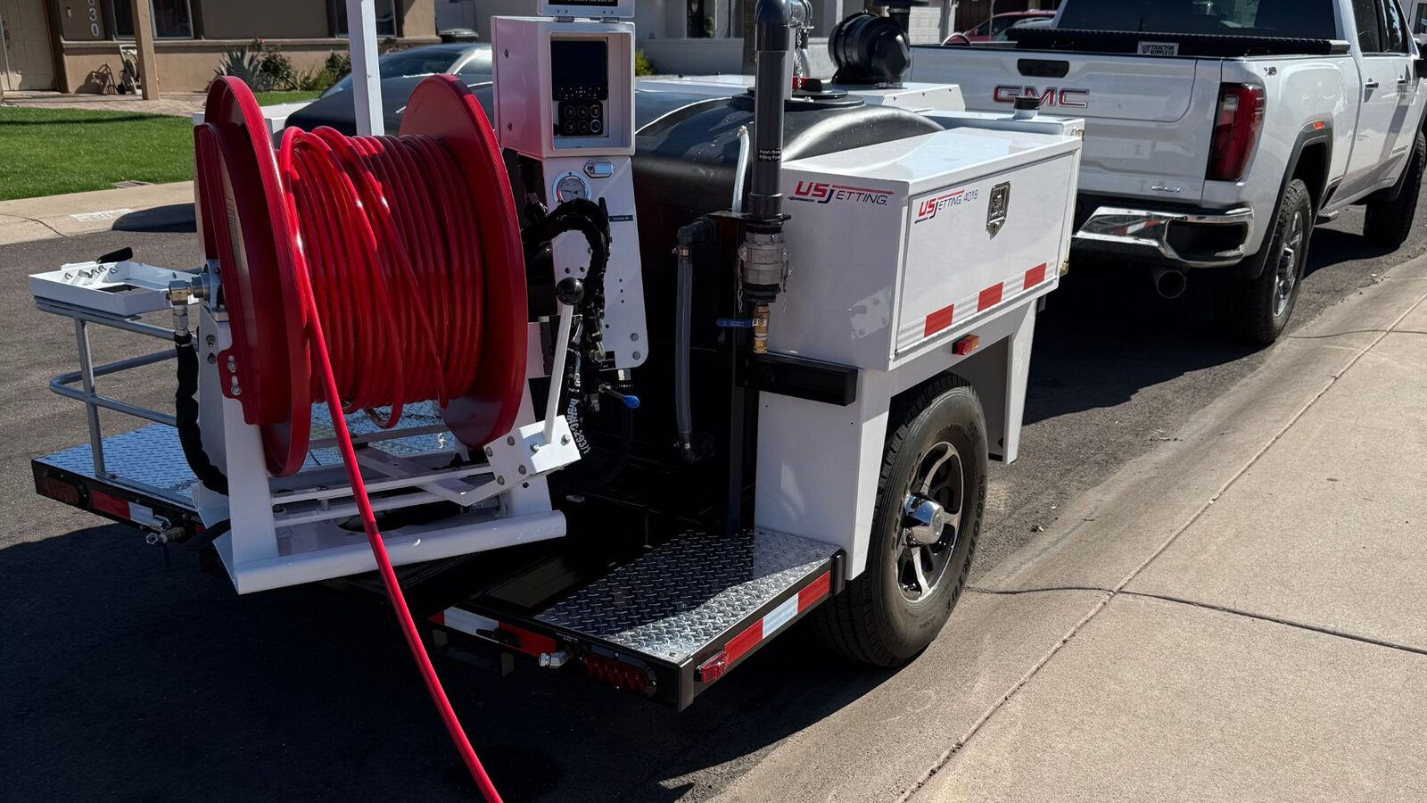 Water Pros technician operating a hydro jetting machine in Gilbert, AZ