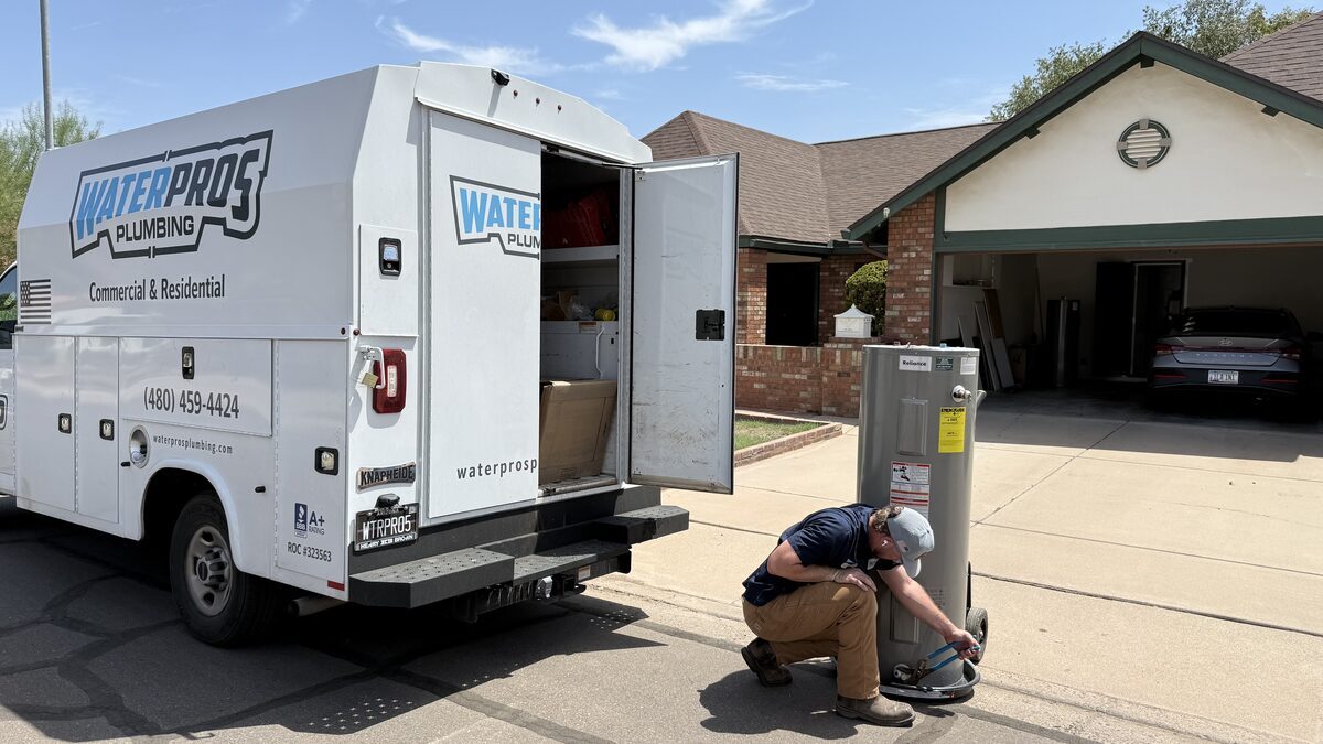 Water Pros Plumbing technician working in a Mesa AZ home