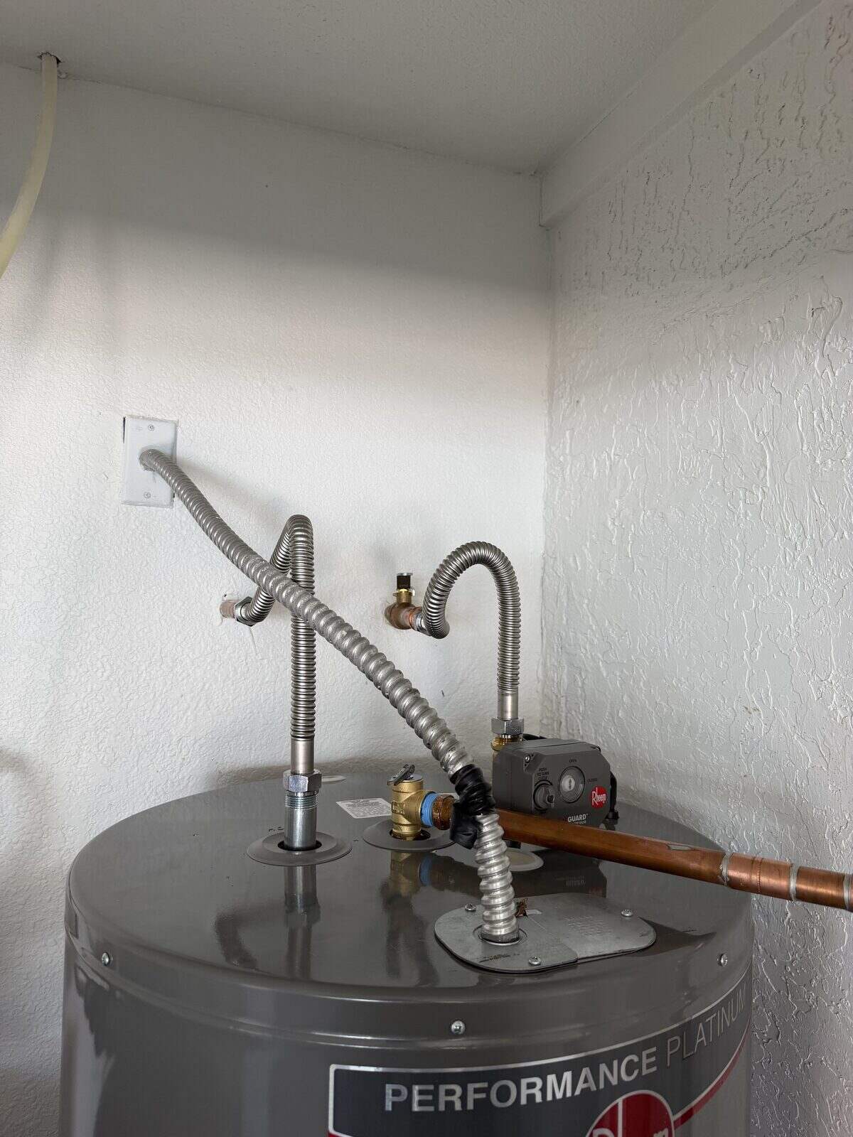 New corrugated stainless supply connectors and cold-side shutoff valve on the replacement Rheem water heater