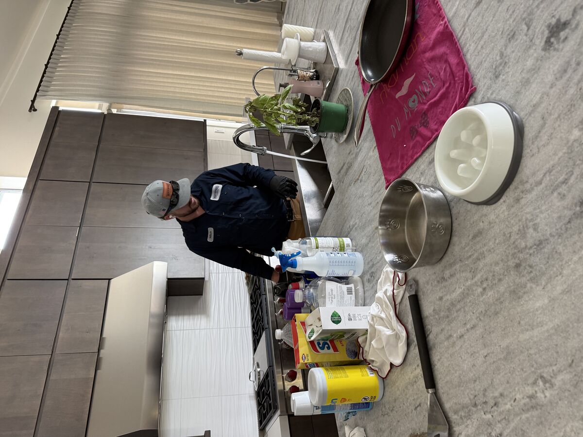 Water Pros Plumbing technician Mitch running both kitchen sinks for a 10-minute flow test after drain cleaning in Troon Scottsdale